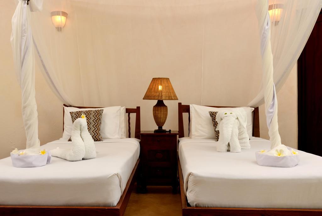 Ocean Paradise Resort & Spa Pwani Mchangani Quarto foto