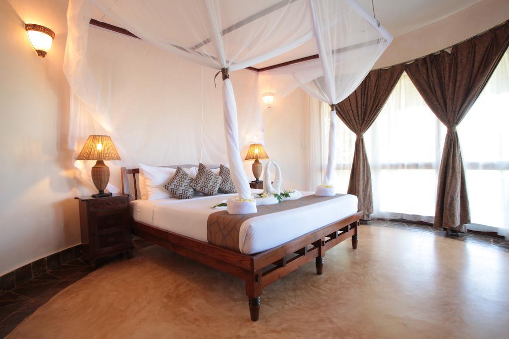 Ocean Paradise Resort & Spa Pwani Mchangani Quarto foto